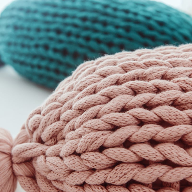 Soft handmade candy-shaped and round pillows