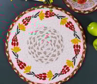 Red fruit and yellow flowers