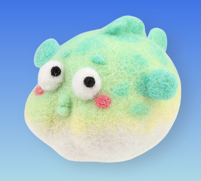 Blue-green surprised fish
