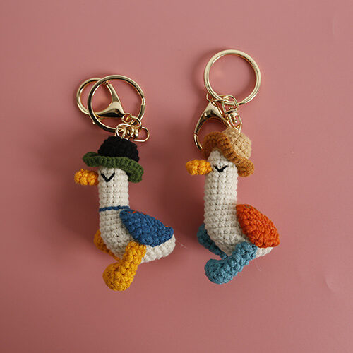 Handmade Crochet Duck Keychain Pair Whimsical Bag Charm with Cowboy Hats and Colorful Wings