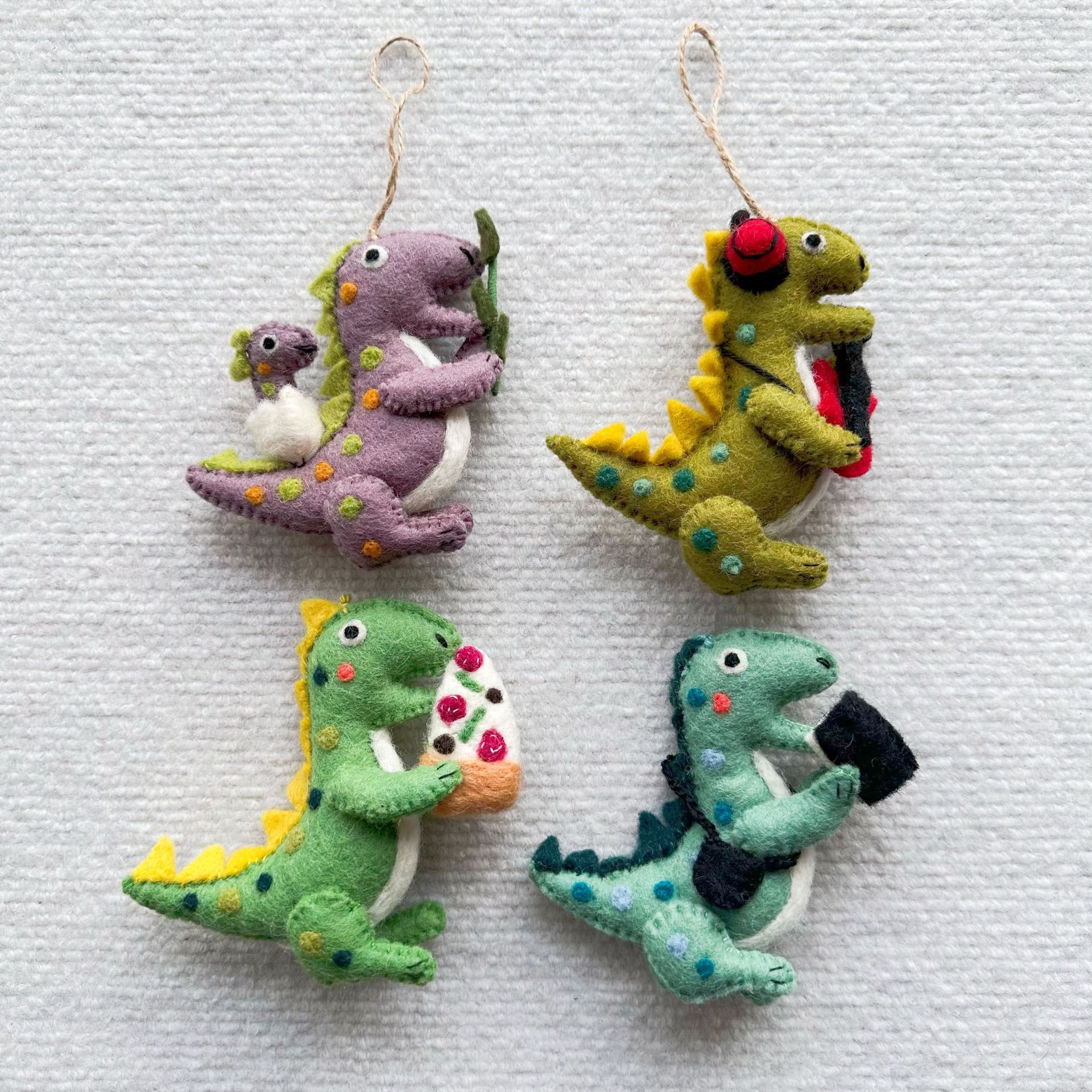 Adorable Handmade Felt Dinosaur Charms Set of 4 – Cute Wool Keychains with Music, Book, Pizza, and Baby Dino Themes for Gift or Bag Decor